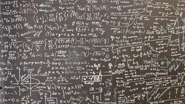 A chalkboard covered in formulas as we learn about determining moisture content