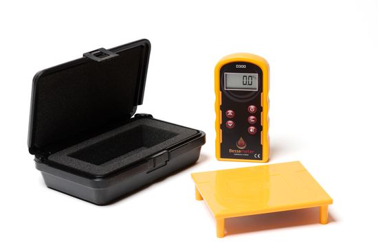 A Bessemeter D300 DeepScan moisture meter with black case and yellow calibration verification reference
