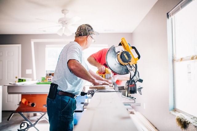 A woodworker preparing boards for a hardwood floor