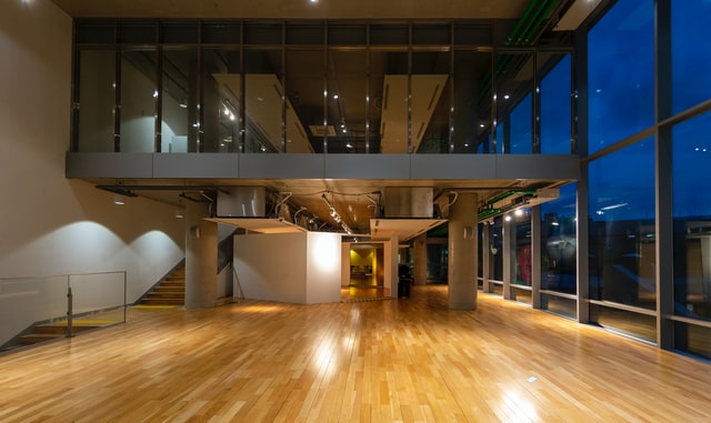 A lobby with a shiny oak hardwood floor