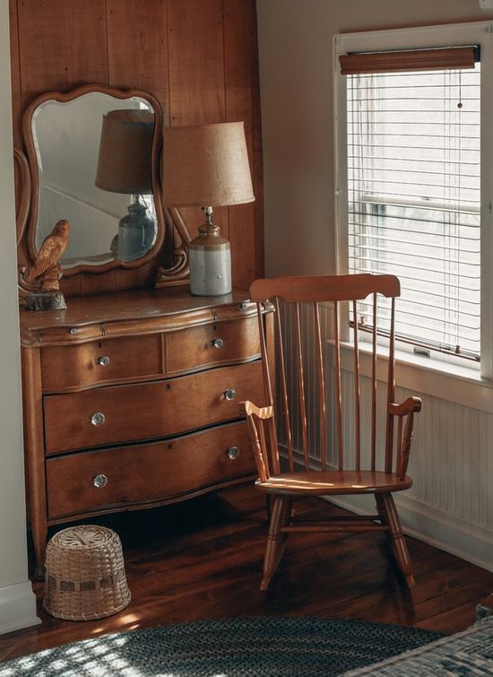 A handcrafted wooden dresser and armchair