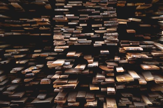 Stacks of wooden boards that need to be acclimated for a furniture project