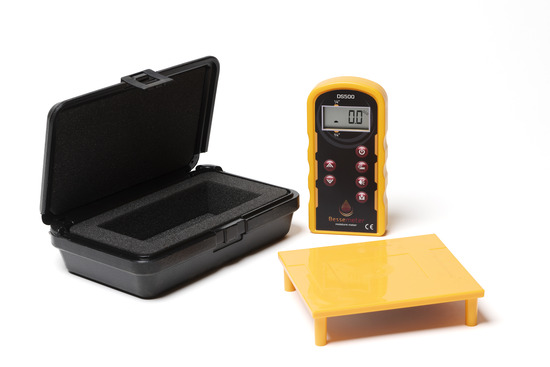 A pinless moisture meter with a black case and a yellow calibration verification reference