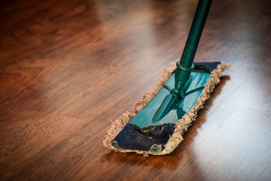 A dry mop on a wood floor to protect it from scratches