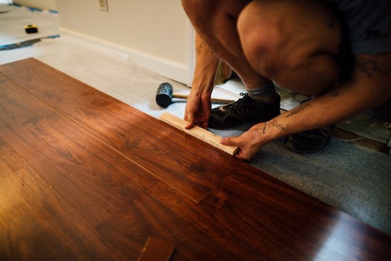 A man installing a laminate floor