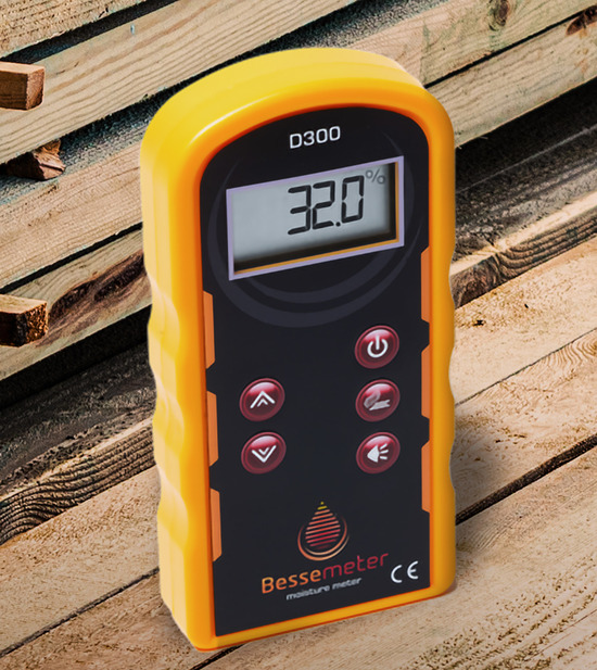 A Bessemeter moisture meter next to a stack of lumber