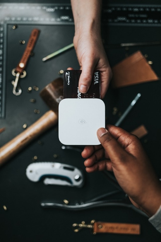 A credit card inserted into a device to purchase wood