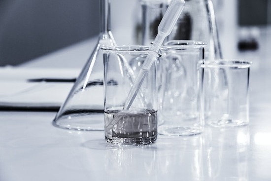 Chemicals in beakers in a lab