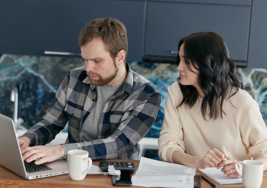 A couple doing research on what flooring to choose