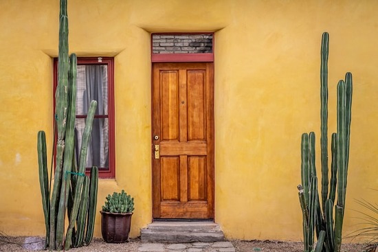The door of a stucco home in a dry climate, where engineered flooring can more easily be affected