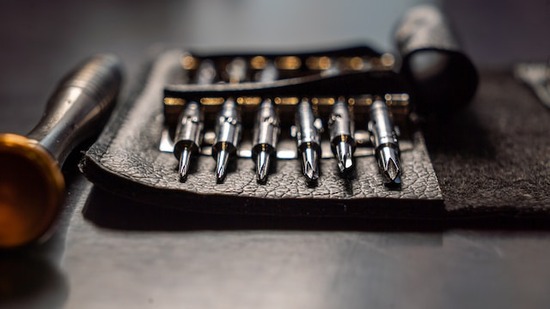 A drill bit set in a leather case