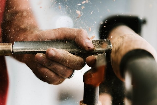  A woodworker using a lathe