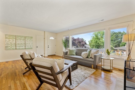 A living room with a hardwood floor