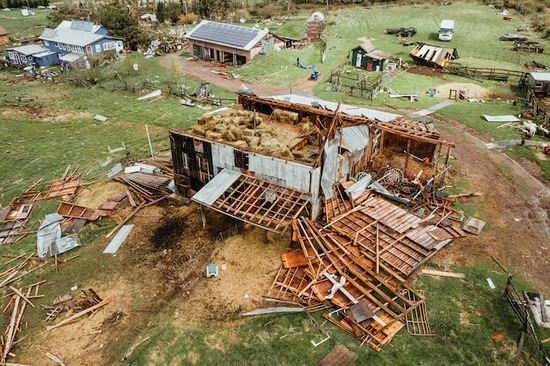 A barn demolition site with plenty of reclaimed wood available