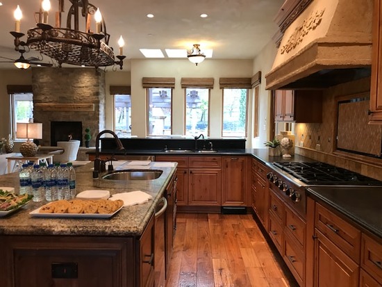 A kitchen with a hardwood floor