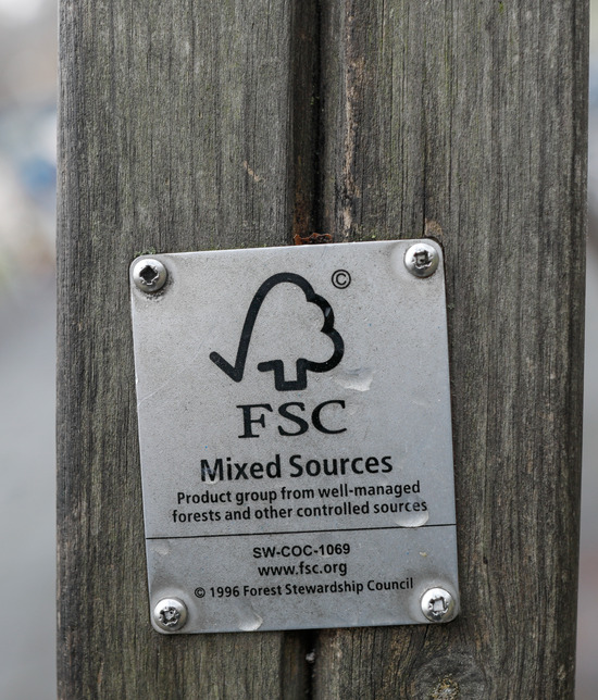 A Forest Stewardship Council Mixed Sources plaque on a piece of wood