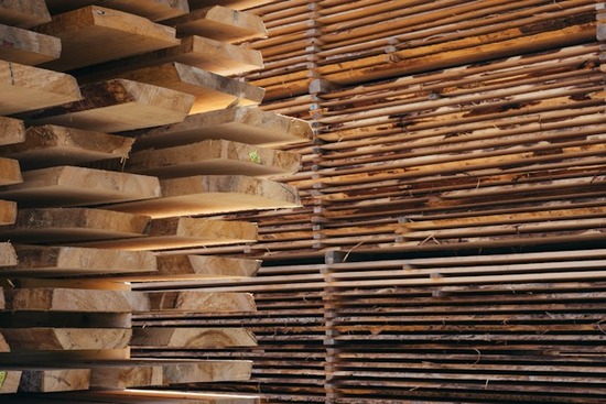  Boards of wood that are stickered for drying