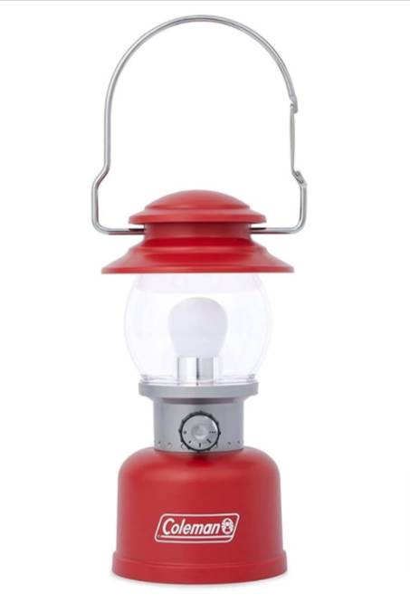A camping lantern with a metal handle